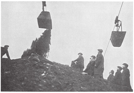 Unemployed Miners watching buckets in the hope that some coal might fall